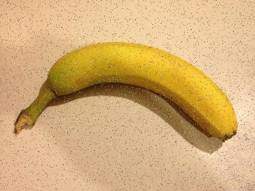 An image of a banana with salt-and-pepper noise